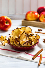 Wall Mural - Baked Cinnamon Red Apple Chips. Selective focus.