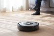 robot vacuum cleaner cleaning a living room
