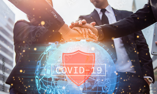 Fotografía Volunteer charity work join hand together for protect covid-19 concept