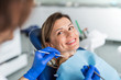 © Halfpoint - A woman has a dental check-up in dentist surgery.