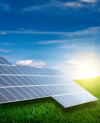 solar electric panels in the green field.