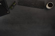 © kjekol - Top view of black concrete office desk with computer and supplies