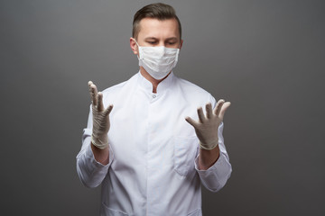 Wall Mural - Doctor wearing protective latex gloves and face mask