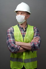 Wall Mural - Worker man wearing hygienic mask and protective hard hat.