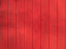 Wooden Texture With Vertical Timber Planks Painted In Red Color. Fence Or House Background