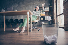 Full Size Photo Of Positive Cheerful Worker Marketer Girl Have No Work Feel Fun Throw Crumpled Paper In Trash Bin Sit Chair In Modern Loft Office