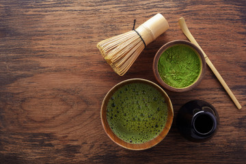 Wall Mural - Set with green matcha tea on wooden background. Japanese tea ceremony. Food menu background. Tea ceremony set.