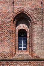 Texture Of A Simple Gothic Window Arch On The Brick Facade Of The Oostkapelle Church Tower In The Netherlands