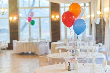 Three multi-colored balloons on holiday. Close-up balloons at an event.