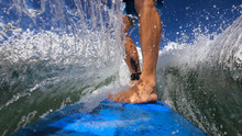 Extreme Close Up View Of A Man Surfing