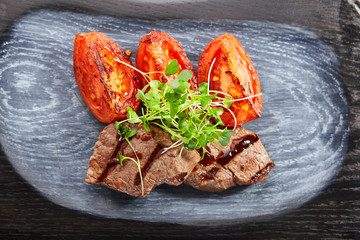 Poster - Grilled marbled beef with tomatoes top view