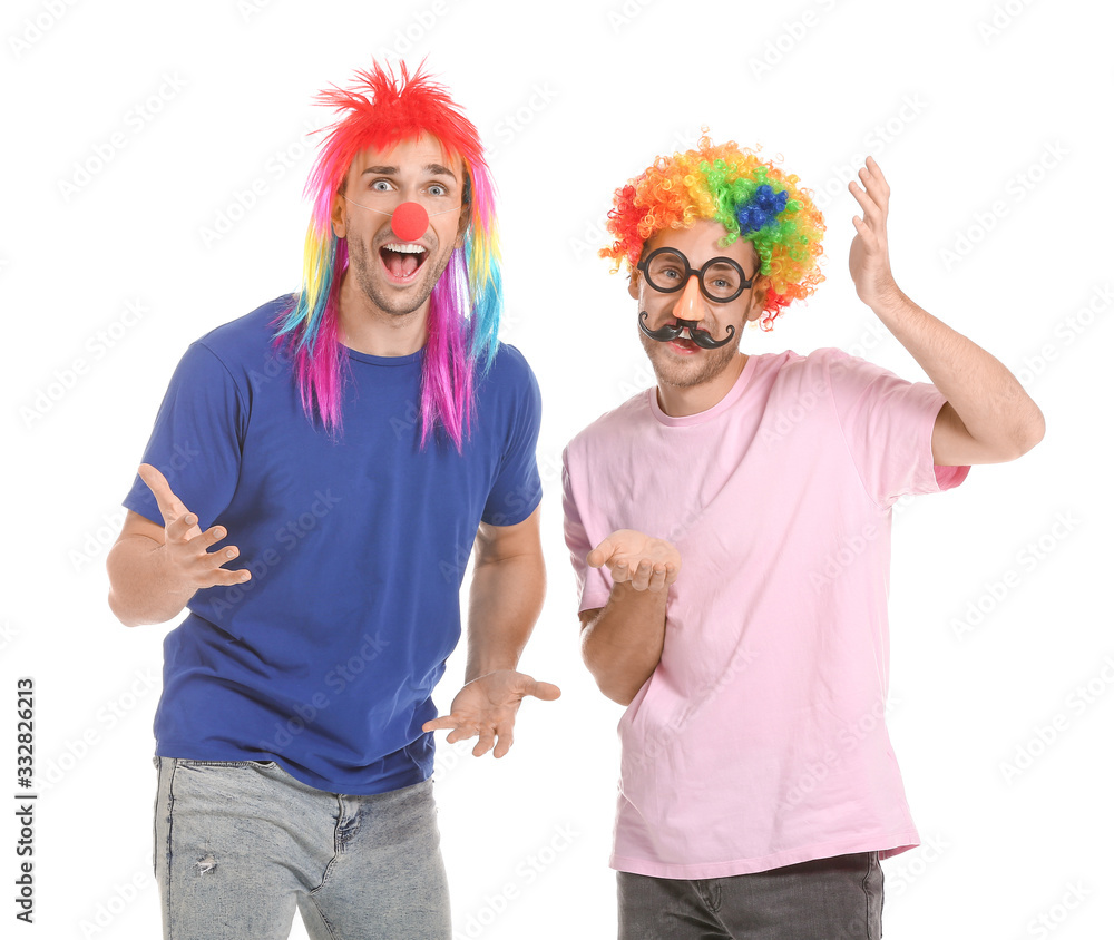 People in funny disguise on white background. April fools' day celebration