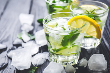 Glasses of fresh lime lemonade on table