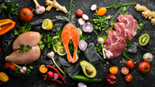 Protein Menu: Meat, Fresh Vegetables, Fruits, And Nuts. Healthy Food On Black Stone Background.