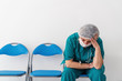 © Sondem - Woman doctor is sitting and has, worry, frustration, tiredness and exhausting deep feelings.