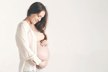 Portrait of the young happy smiling pregnant woman