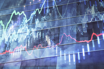 Forex chart on cityscape with tall buildings background multi exposure. Financial research concept.