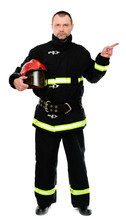 Vertical Isolated Photo Of A Firefighter In Uniform With A Red Helmet In His Hands