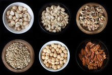 6 Small Bowls Of Nuts: Macadamias, Cashews, Walnuts, Pine Nuts, Hazelnuts And Pecans