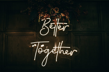 Wall Mural - Better Together - neon sign on a brick wall in a restaurant at a wedding party. Love concept	