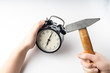 © Антон Скрипачев - hands and vintage alarm clock and hammer, concept, selective focus, tinted image