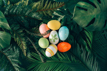 Creative Easter Nature Background. Green Tropical Palm Leaves With Easter Eggs. Minimal Spring Abstract Jungle Or Forest Composition. Contemporary Style.