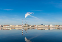 Smoking Chimneys On The Blue Sky Background. Heat Station Pipes, Smoke. Industrial St. Petersburg - March 17, 2020 
