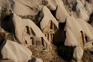 Uchisar castle in Cappadocia, Turkey. Cave houses in cones sand hills, Anatolia.