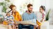 © JenkoAtaman - Happy family with map and passports planning travel.