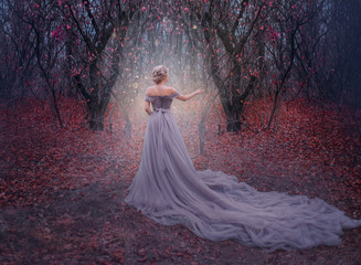 art photo young beauty woman queen. autumn purple mystic tree. fantasy entrance world magic divine g