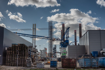 Wall Mural - Wind power rig construction site in Esbjerg harbor, Denmark