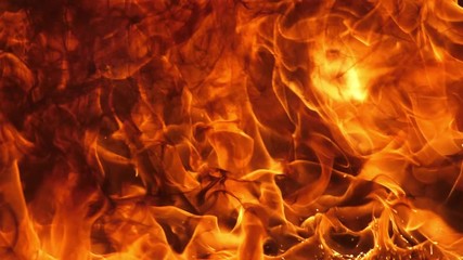 Wall Mural - slow motion speed close up scene of moving burning pattern as background. hot as inferno flame conce
