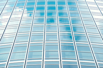 underside panoramic and perspective view to steel blue glass high rise building skyscrapers, business concept of successful industrial architecture