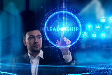 Business, Technology, Internet and network concept. Young businessman working on a virtual screen of the future and sees the inscription: Leadership