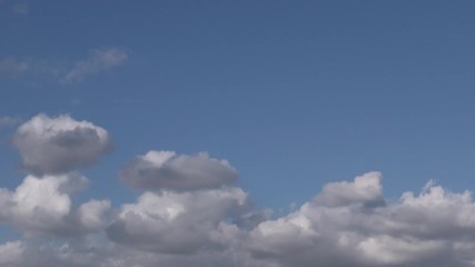 Wall Mural - fluffy clouds background texture time-laps in 4k 