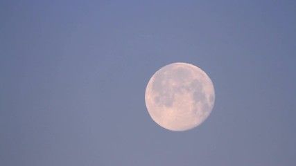 early morning view of the moon on a clear sky