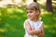 © nagaets - Beautiful little young girl outdoorin a park.