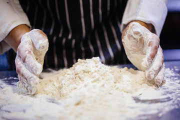 Wall Mural - Man working with dough