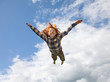© Tim Booth Photography/Stocksy - Young boy flying in the air