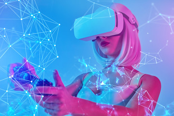 Futuristic woman playing VR game