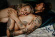 © Chris Zielecki/Stocksy - Happy spiritual couple resting on bed