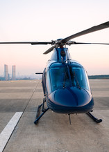 Beautiful Blue Helicopter Stands On The Helipad And Is Preparing To Fly Over The Metropolis
