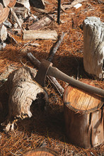 Chopping Firewood In Winter - Log Pile With Axe