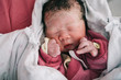 © Pansfun Images/Stocksy - portrait of newborn baby girl