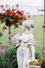Statue Of Woman In The Garden