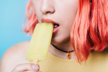 Young Woman With Lemon Ice Lolly