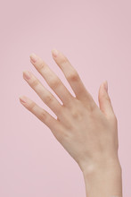 Hand Against Pink Background