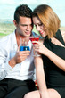 © Tandem - Beautiful couple having a cocktail or a drink in a bar