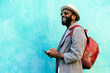 © Santi Nunez/Stocksy - African man using mobile phone