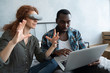 © Dmitry Borovikov/Stocksy - African man and red-haired woman having fun in glasses of virtual reality